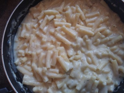 homemade macaroni and cheese with milk and pepper