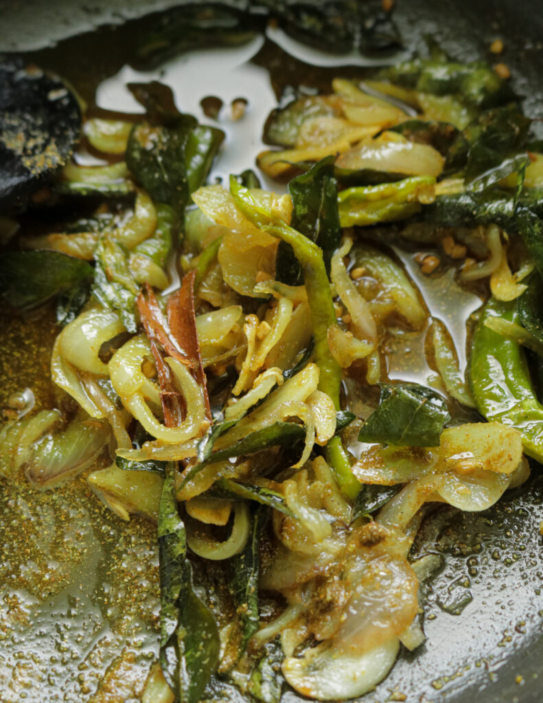 cooked spices with onions and garlic to make the egg curry.