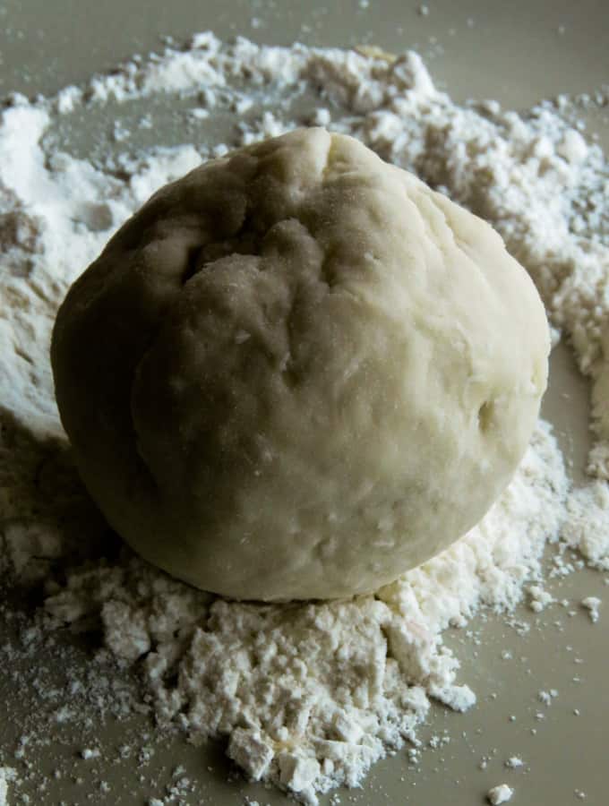 a fully covered dough ball with tuna filling inside.