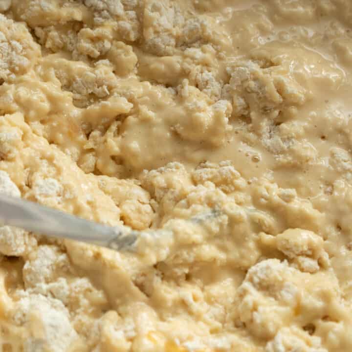 mixing the dry and wet ingredients to make the american pancakes.