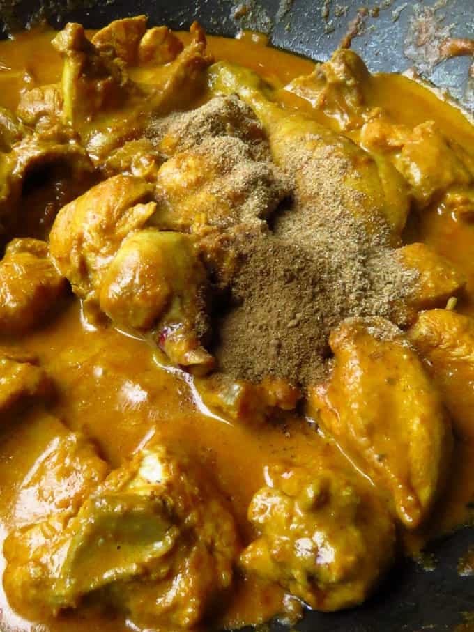thick chicken mughlai curry with spice powders added.