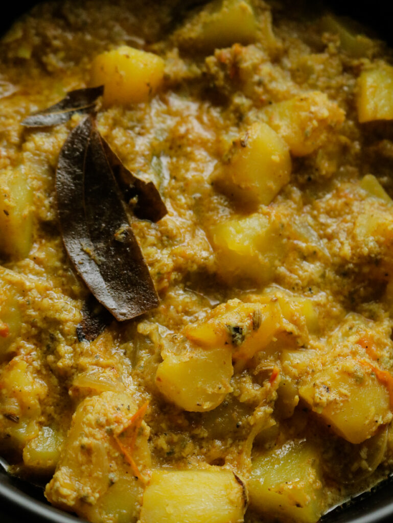aloo kurma or potato korma, a thick potato curry with bay leaves and spices.
