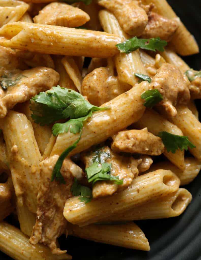Thai chicken curry pasta with crispy chicken pieces and in a creamy coconut sauce