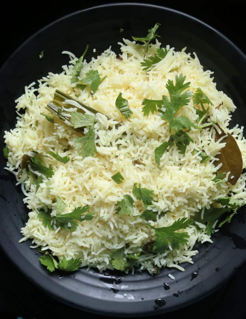 basmati coconut rice cooked in coconut milk and garnished with coriander leaves.