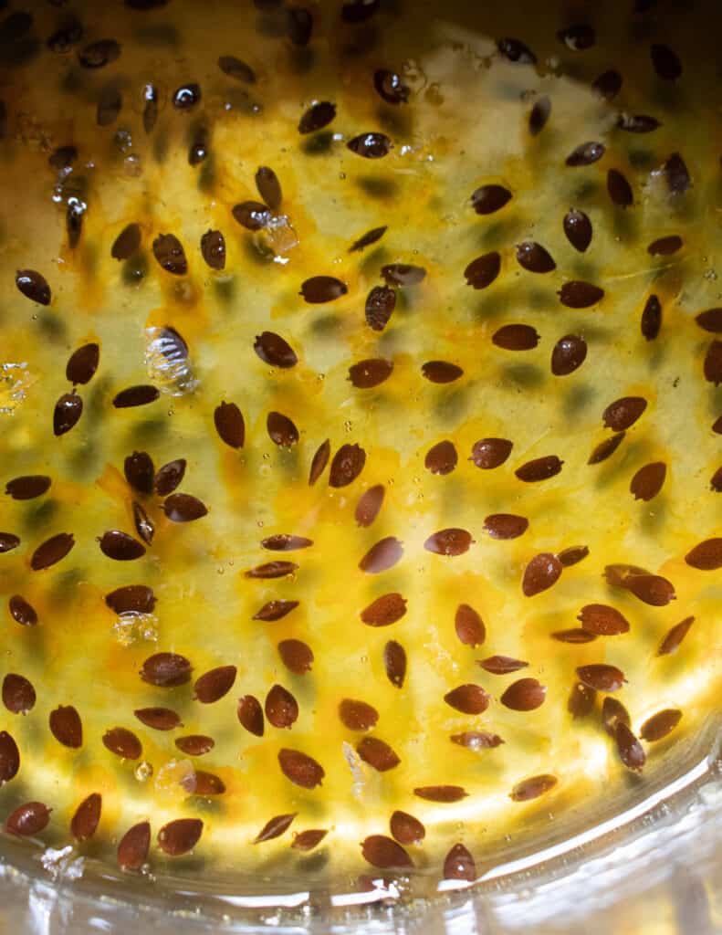 making the passion fruit syrup with passion fruit seeds.