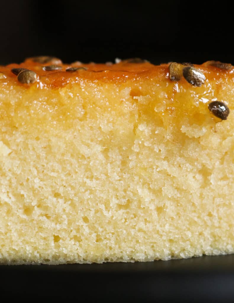fluffy passion fruit cake with passion fruit syrup drizzling.