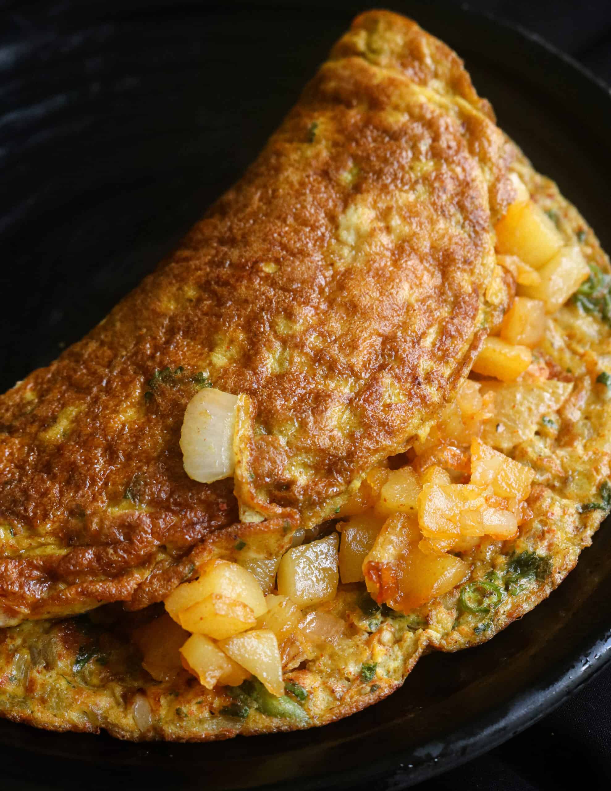 spicy masala omelette stuffed with fried potatoes for variation.