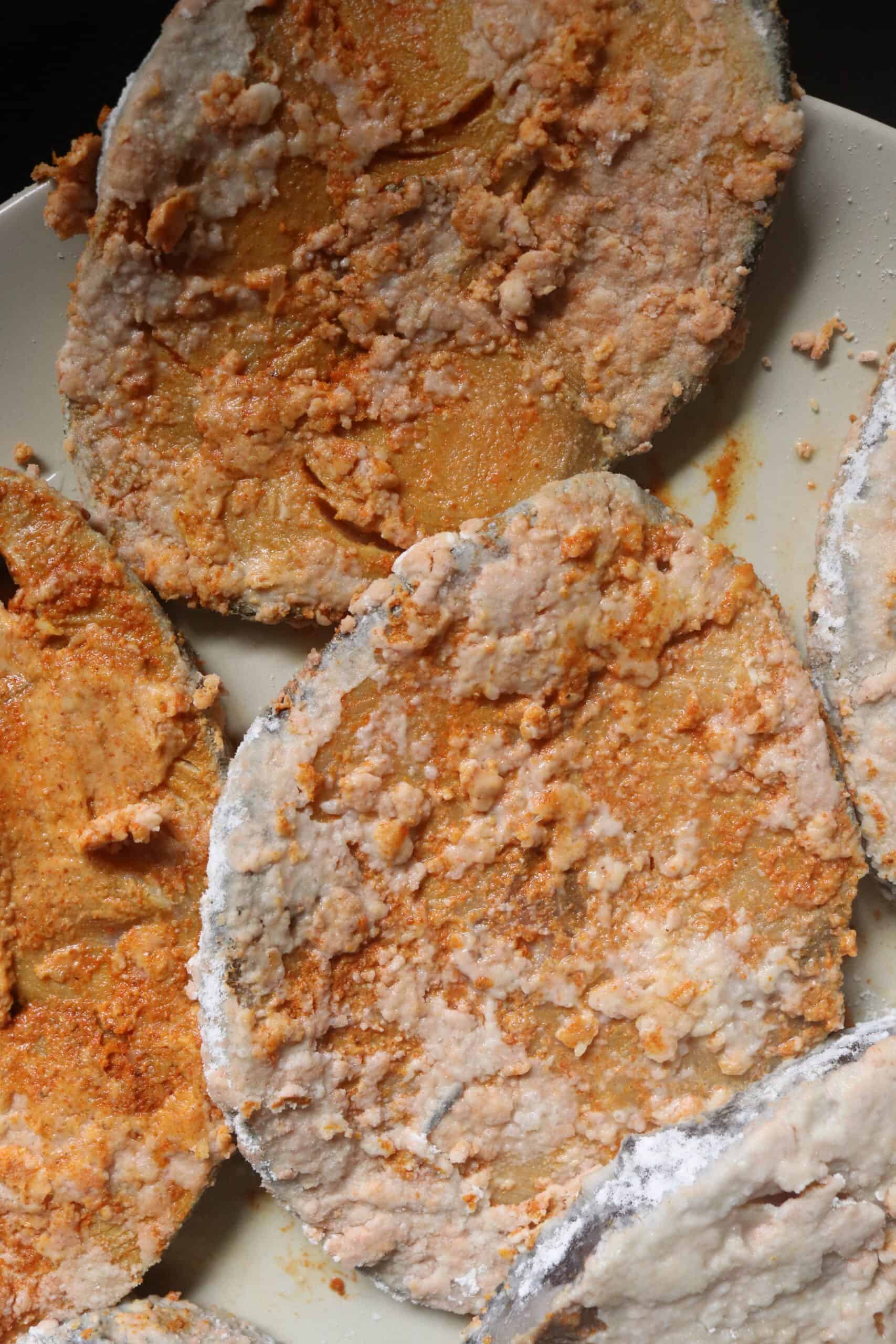 fish steaks covered in a flour mix before frying them.