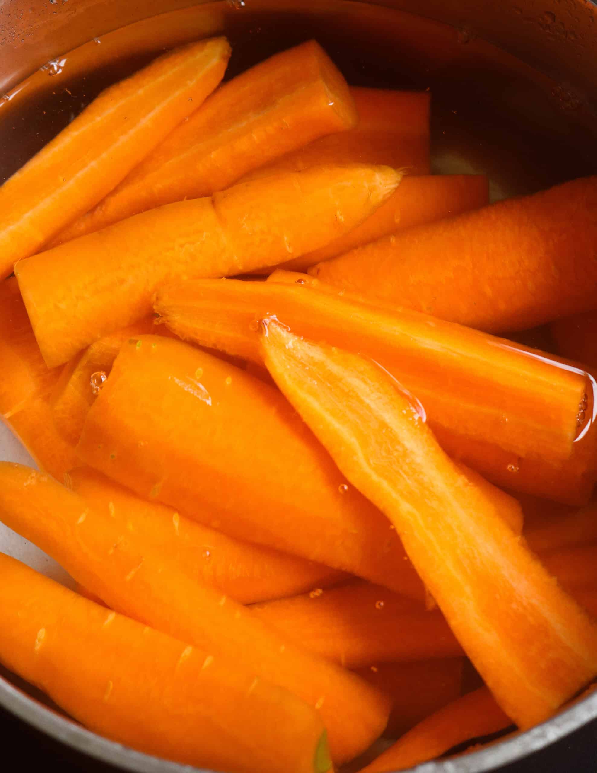 boiling the thick carrot slices.