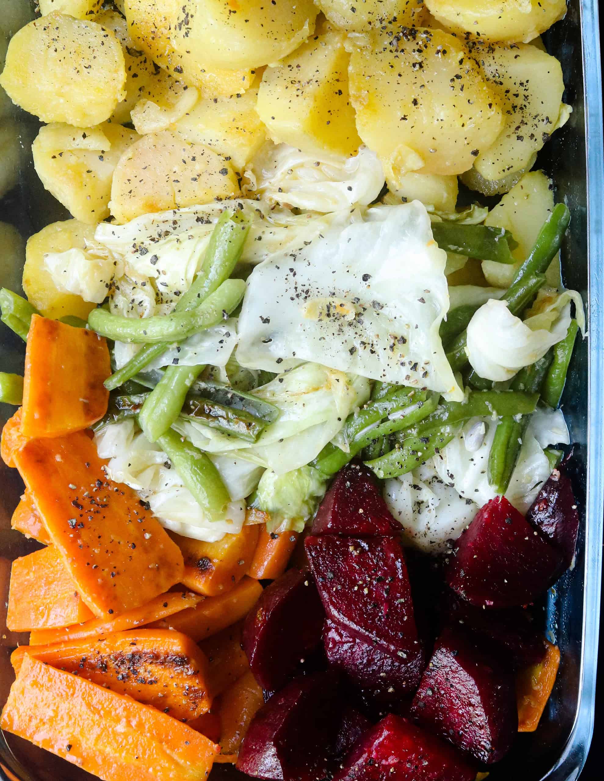 mixed boiled vegetables with seasoning and garlic oil.